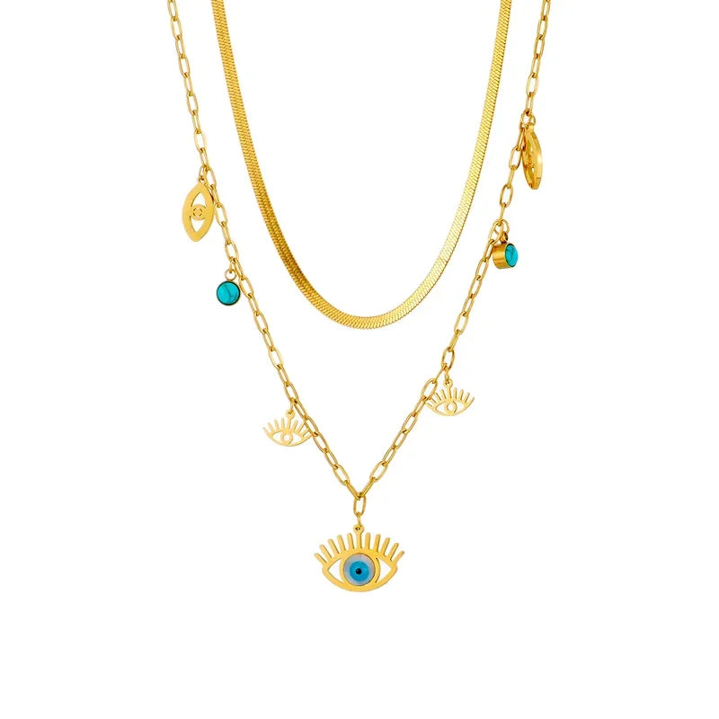 Double layer gold necklace with eye-shaped pendants on a white background