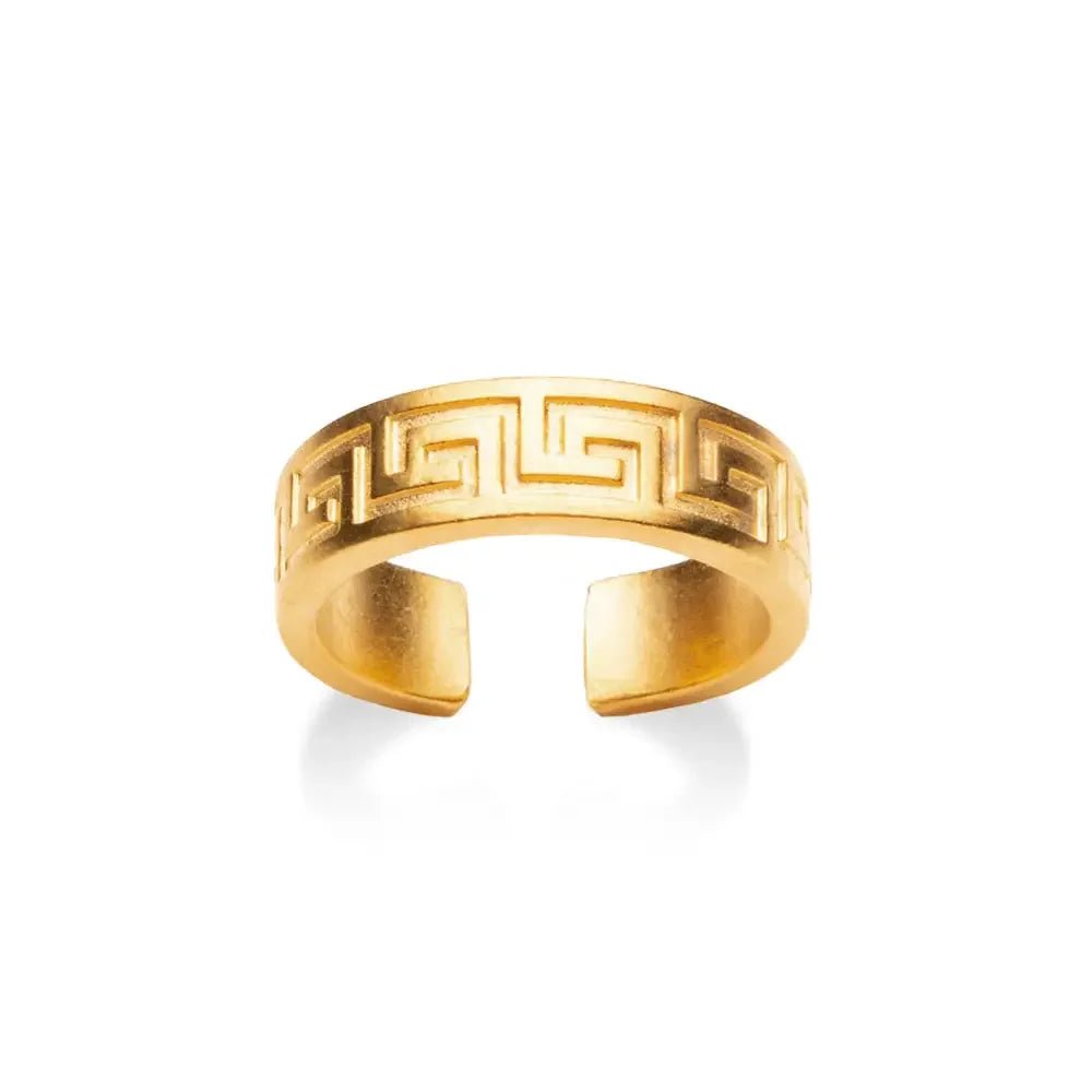 Gold open-toe ring with Greek key design on a white background