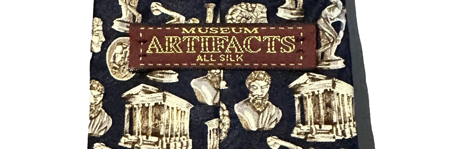 Navy silk tie with classical architecture design and 'Museum Artifacts' label