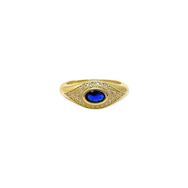 Gold ring with a blue gemstone on a white background