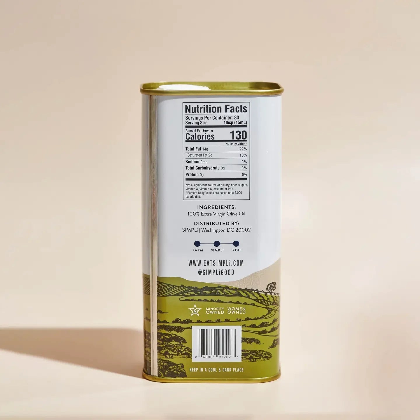 Olive oil can with nutrition facts label on a beige background