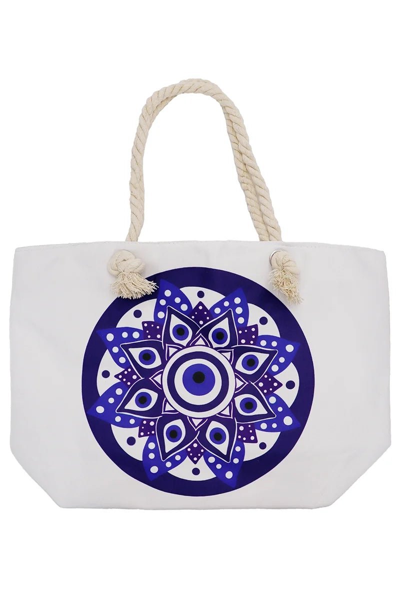 White tote bag with blue evil eye mandala design and rope handles on a white background
