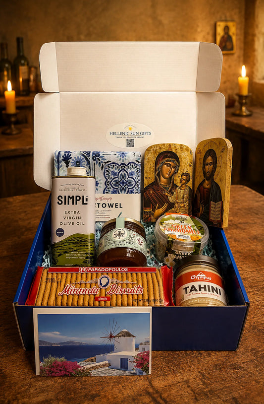 Gourmet gift box with Greek-themed items on a wooden table.