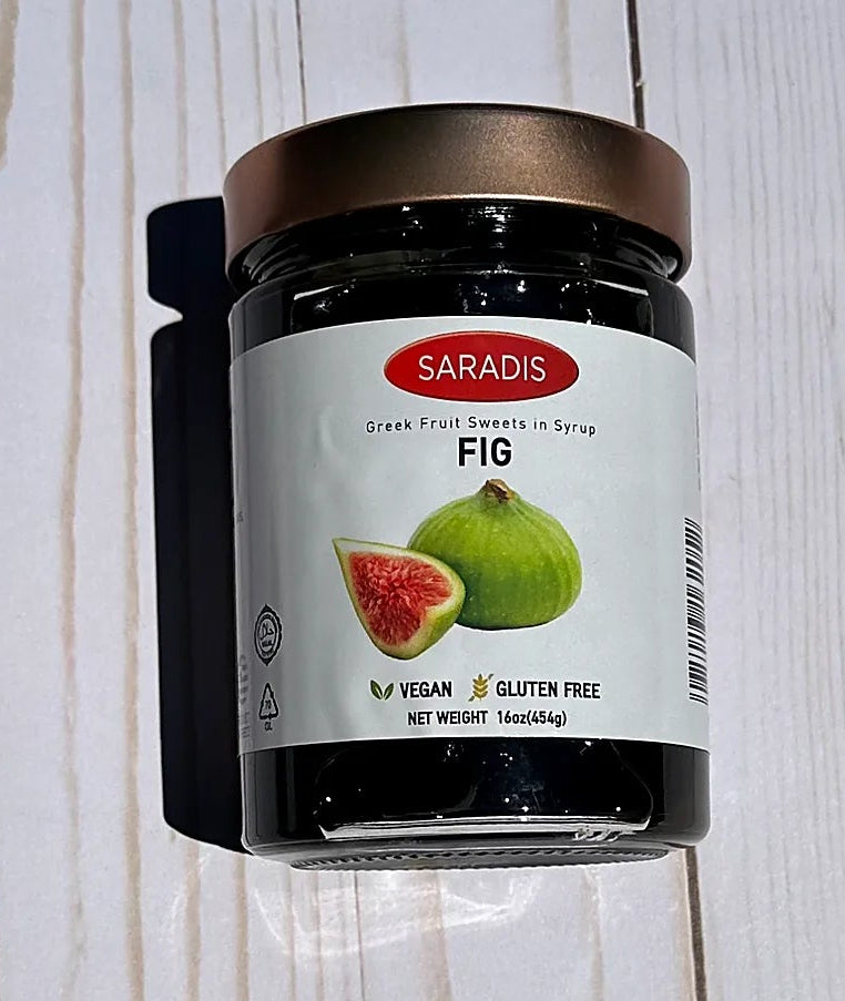 Jar of Saradis Fig Spread on a wooden surface