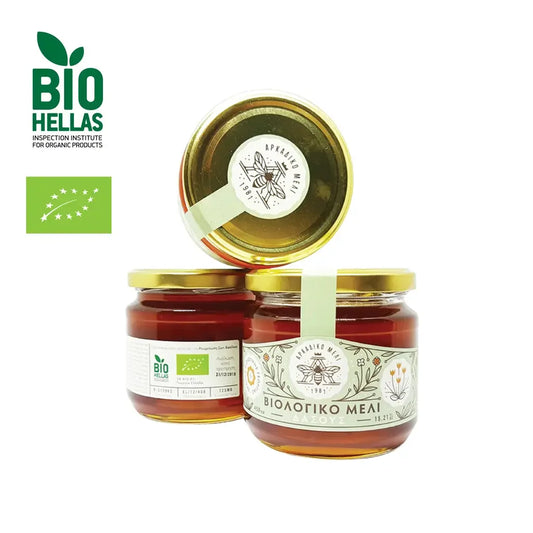 Three jars of honey with aBio Hellas logo on a white background