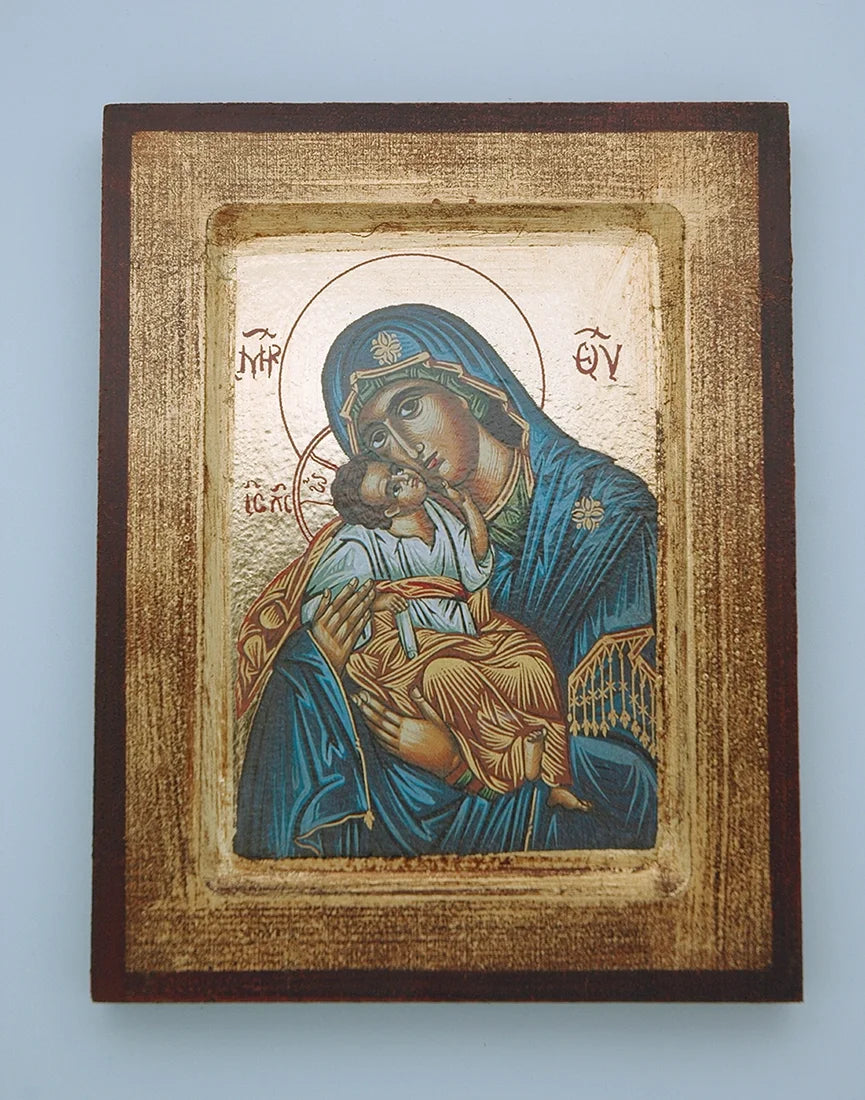 Icon of a religious figure holding a child against a textured background