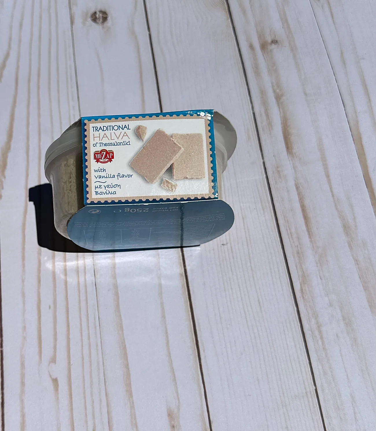 Box of halva on a wooden surface