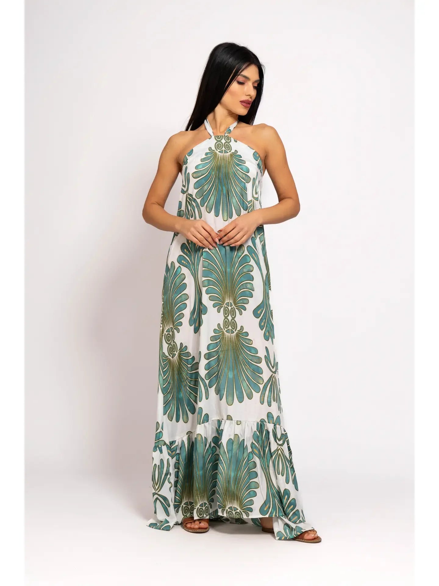 Woman wearing a floral-patterned dress on a white background