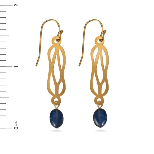 Gold earrings with blue stones next to a ruler on a white background