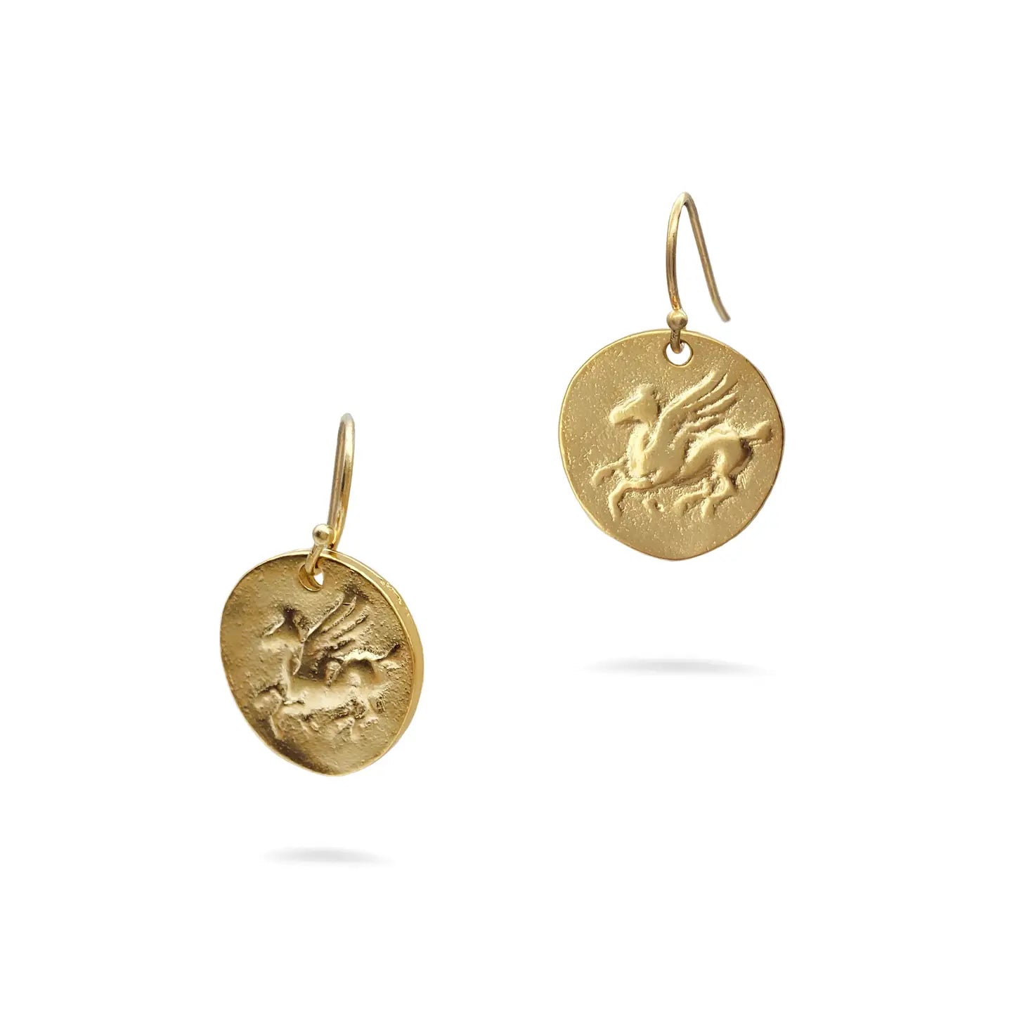 Gold Pegasus earrings with engraved designs on a white background