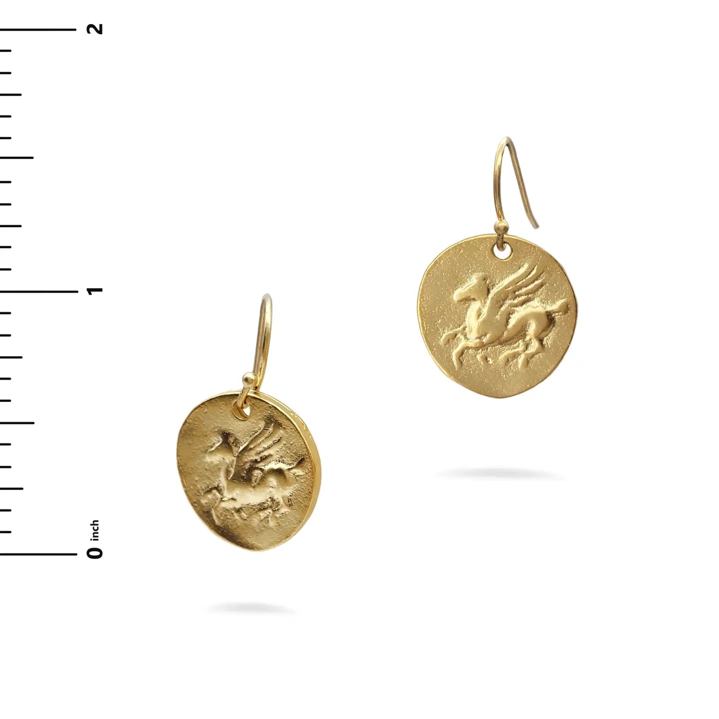Gold Pegasus earrings with a bird design on a white background with a ruler for scale.