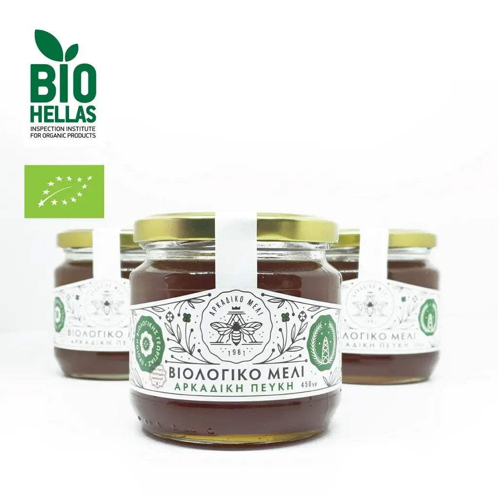 Jars of honey with Bio Hellas labels on a white background