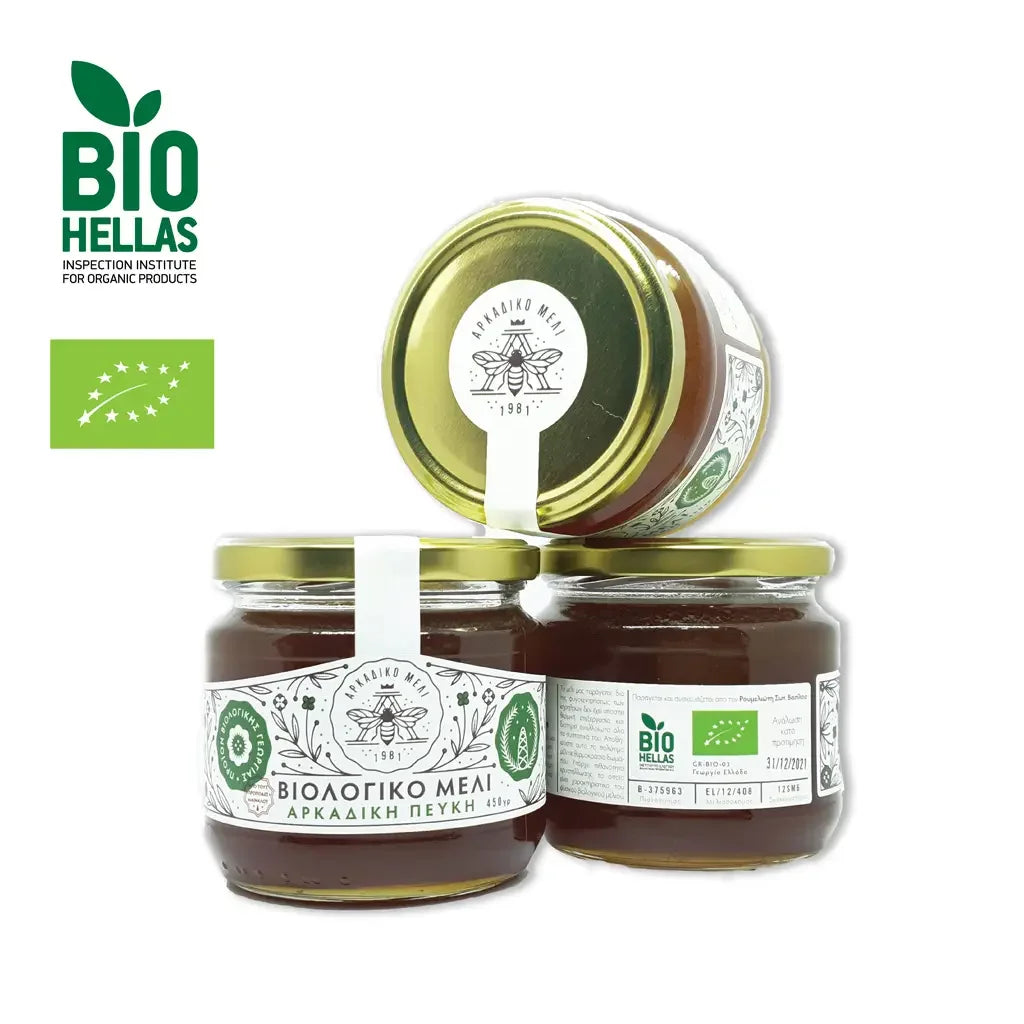 Three jars of honey with visible labels on a white background, featuring the Bio Hellas logo