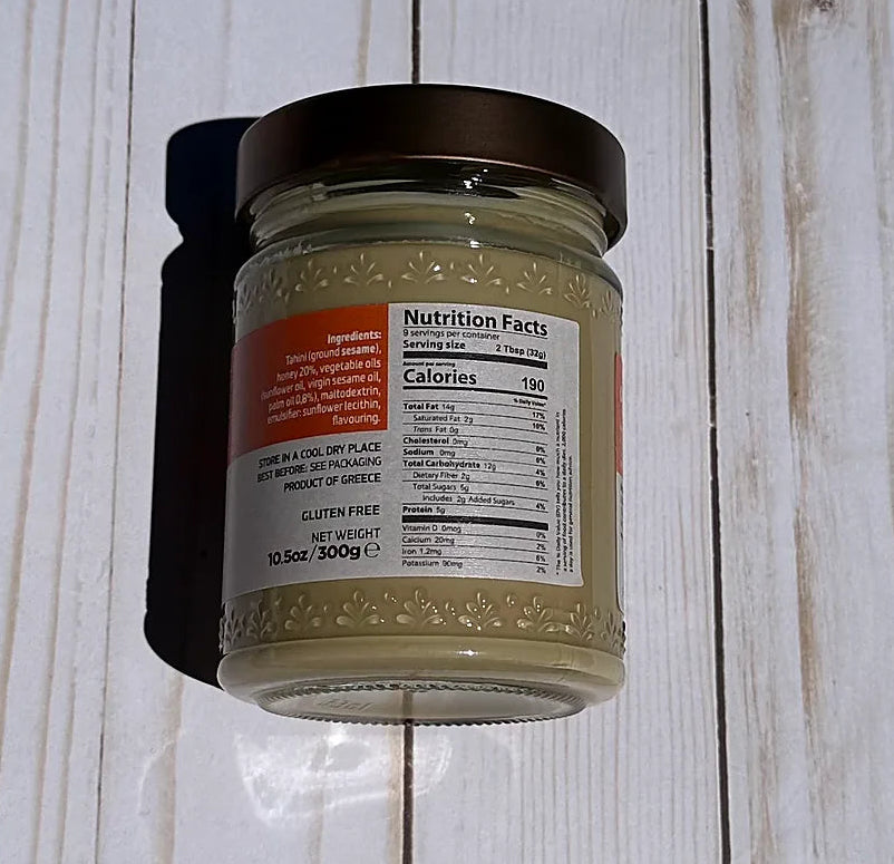 Olympos Tahini Jar with a nutritional label on a wooden surface