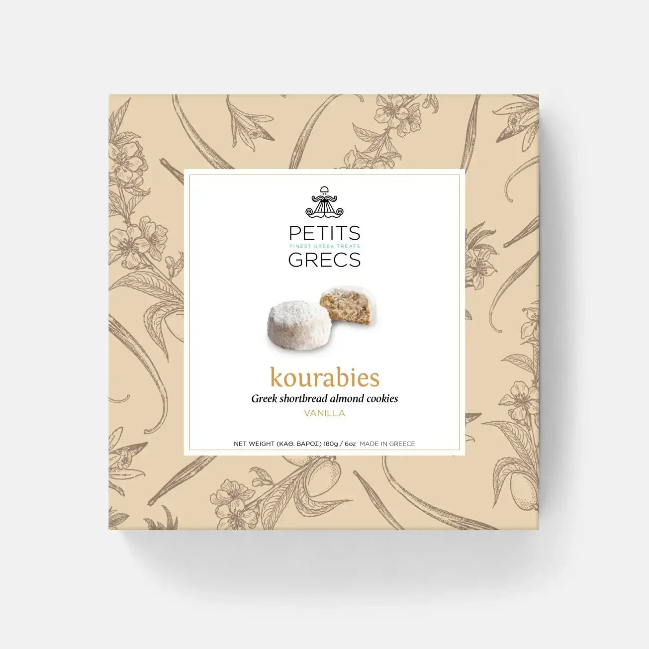Box of Petits Grecs kourabies cookies with decorative design on a white background