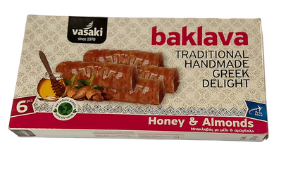 Box of Vasaki baklava with honey and almonds on a white background