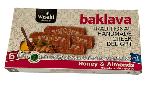 Box of Vasaki baklava with honey and almonds on a white background