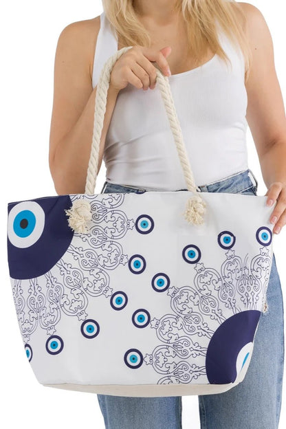 Lovely woman holding an evil eye mati tote bag with blue and white pattern