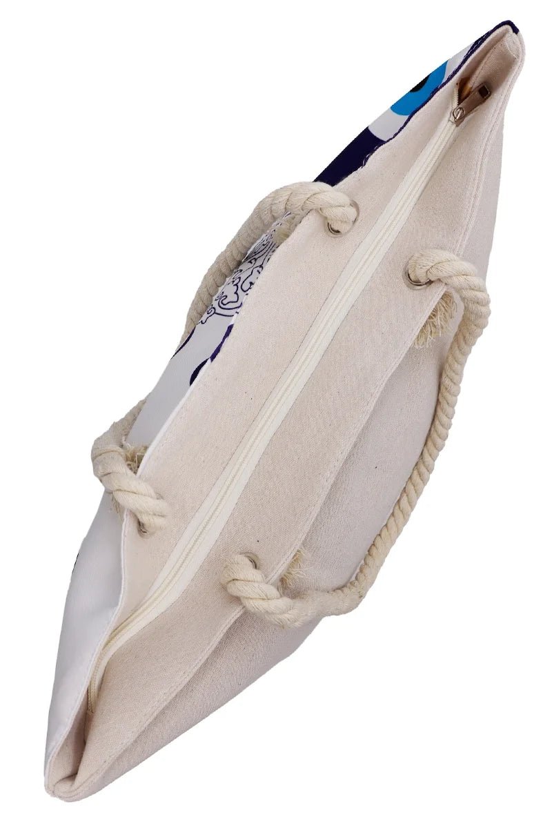 Tote bag with rope handles and mati evil eye design on a white background - top side zipper view