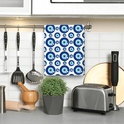 Kitchen scene with a blue and white patterned towel hanging on a rack, toaster, and various kitchen utensils