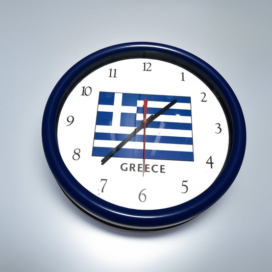 Wall clock with Greek flag design on a gray background