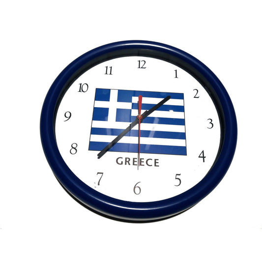 Wall clock with Greek flag design on a white wall background