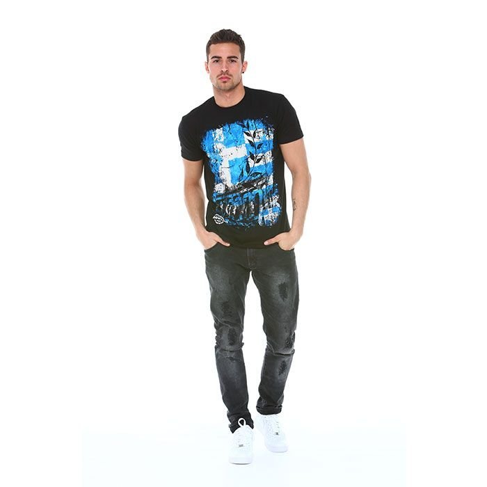 Man wearing a black t-shirt with a blue graphic design and dark jeans on a white background