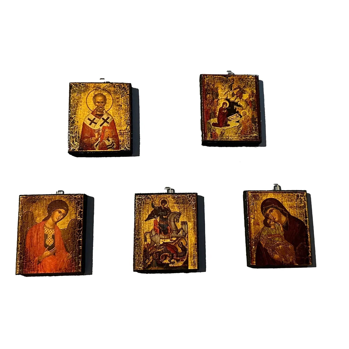 Set of five miniature religious icon ornaments on a white background