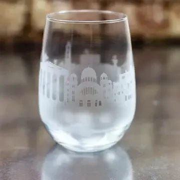 Clear glass with etched Greek architecture design on a reflective surface