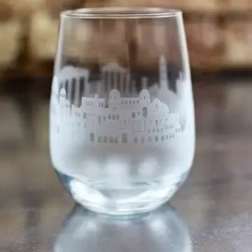 Clear glass with etched Greek architecture design on a reflective surface