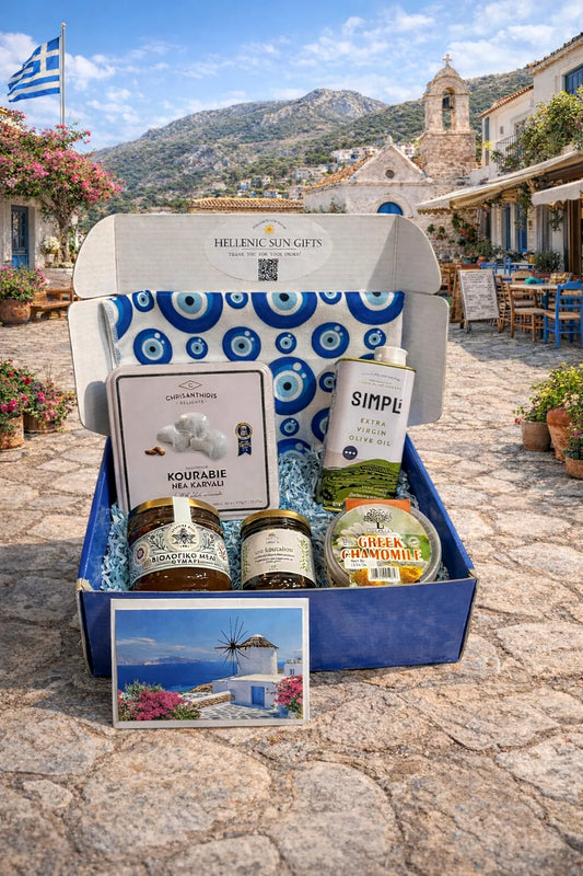 Gift box with Greek products on a stone path with a scenic background