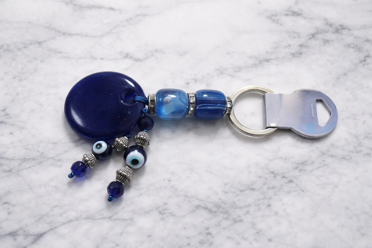 Blue beaded keychain on a marble surface
