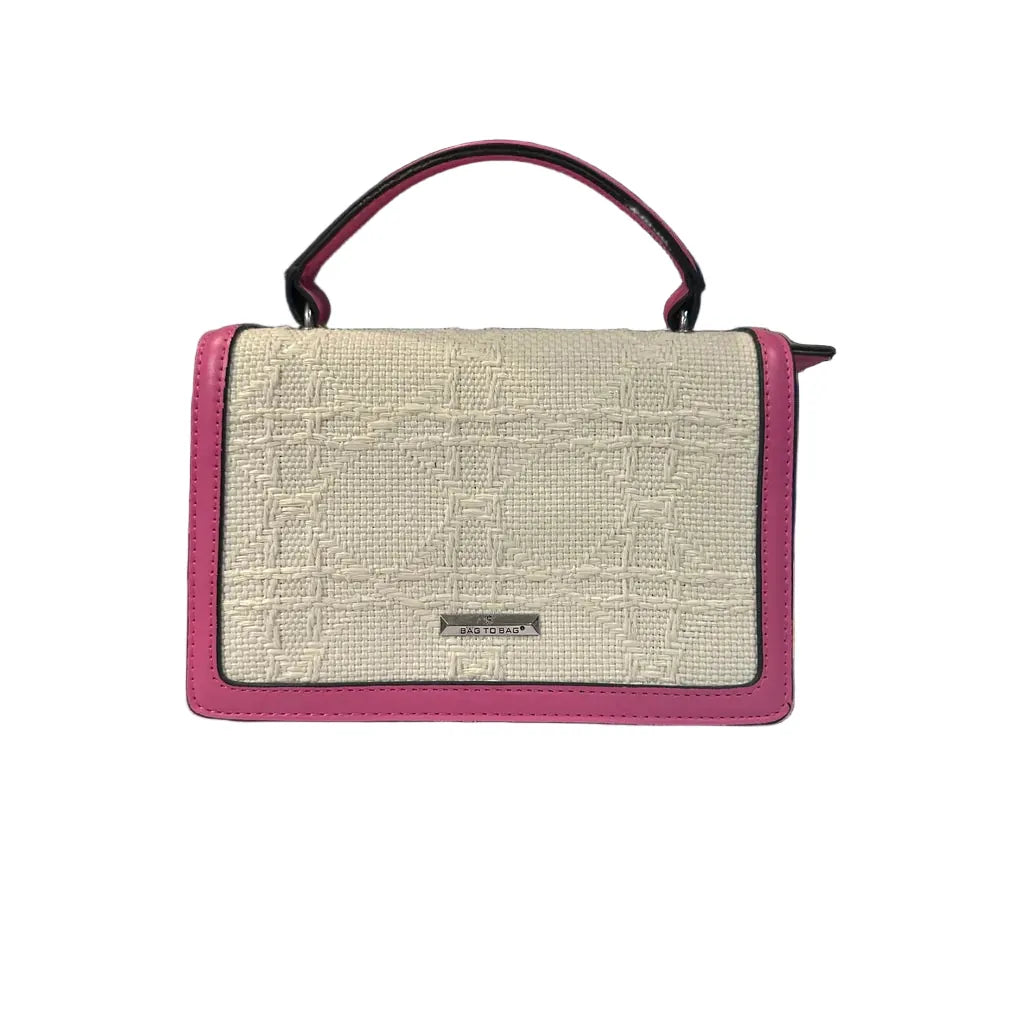 Handbag with textured beige front panel and pink sides on a white background