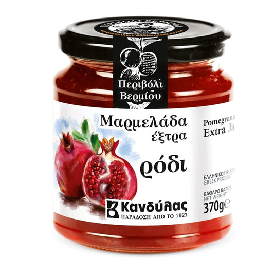 Jar of pomegranate jam with a visible brand label on a white background