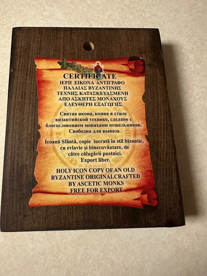Certificate for a holy icon copy on a wooden plaque with text.
