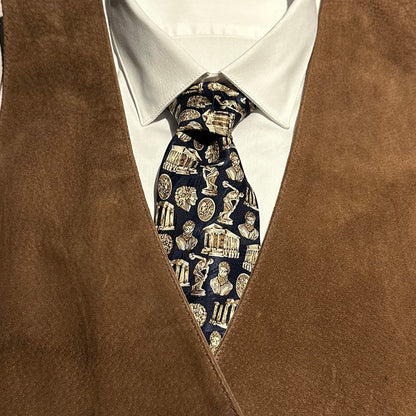 Brown vest over a white shirt with a navy tie with Greek classical architecture and sculptures