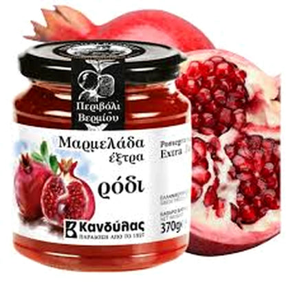 Jar of pomegranate marmalade with pomegranate fruits on a white background
