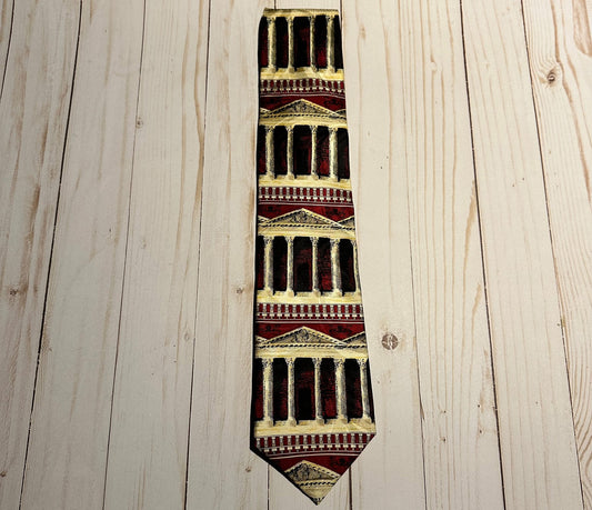 Tie with Greek column architectural design on a wooden surface