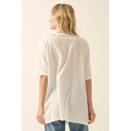 Person wearing a white t-shirt and blue jeans on a beige background