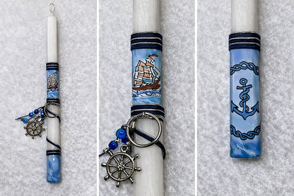 Decorative candles with nautical-themed ribbons and charms on a gray background