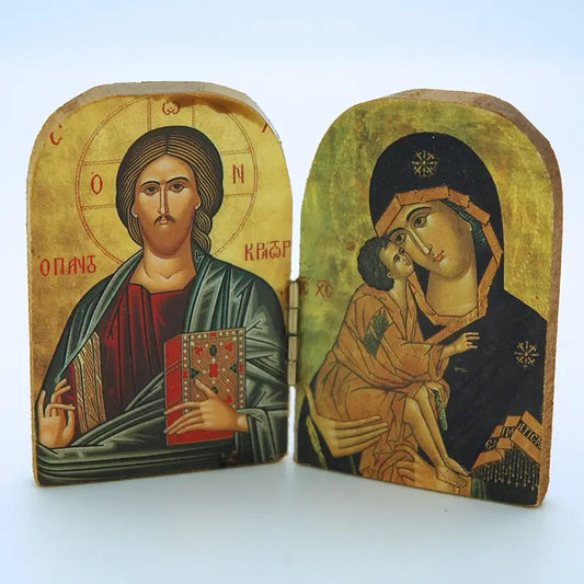 Two religious icons of Jesus and Mary with child on a white background