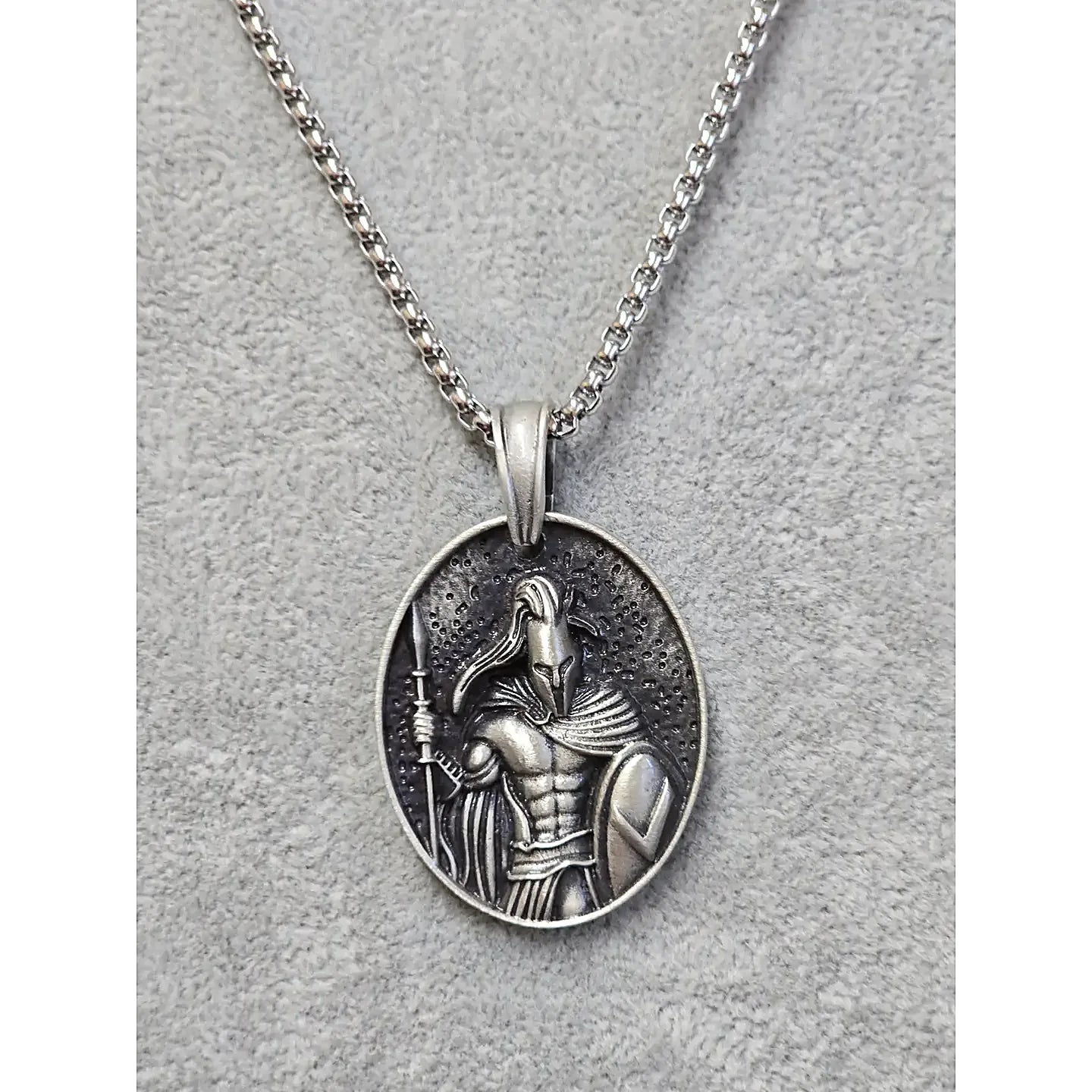 Titanium Warrior stainless steel oval pendant—front relief of armored warrior on 23-inch chain